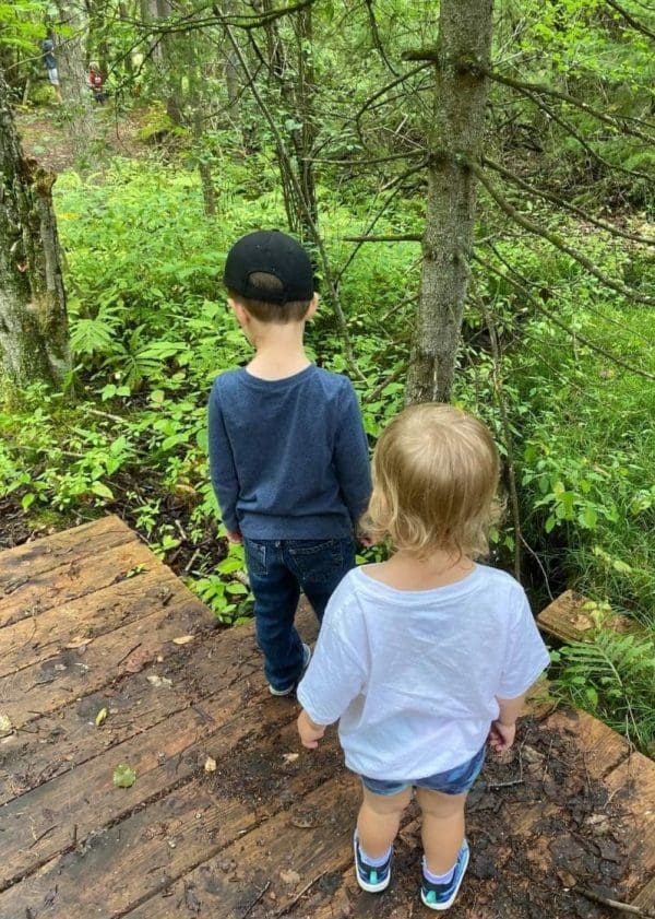 Little Farmers walking through the forest